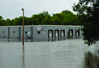 Flood water surrounds property